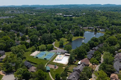 an aerial view of a house with outdoor space