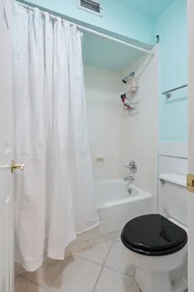 a bathroom with a sink a toilet and bathtub