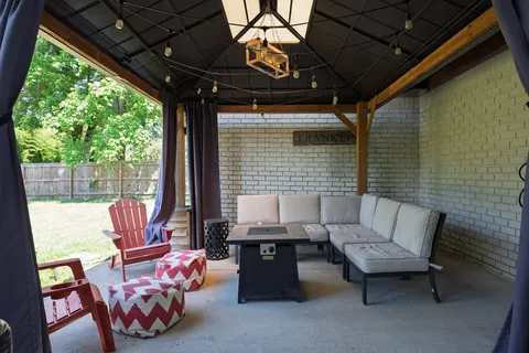 a outdoor living space with patio furniture and a potted plant