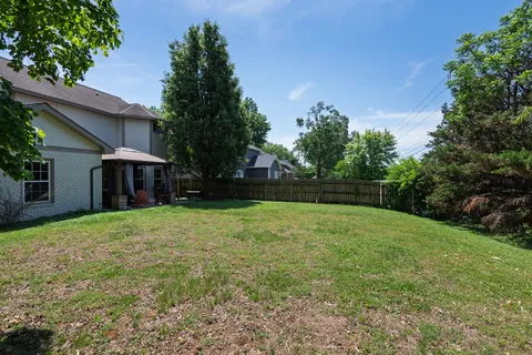 a backyard of a house with lots of green space