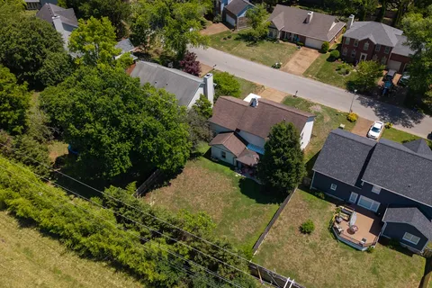 an aerial view of a house with garden
