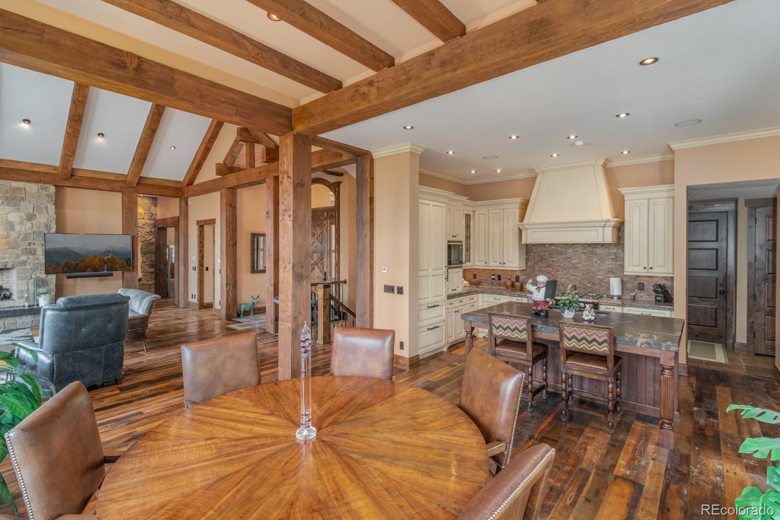 30 West Ranch Trail Morrison, CO 80465 - Photo 12 of 40 a living room with furniture and a flat screen tv