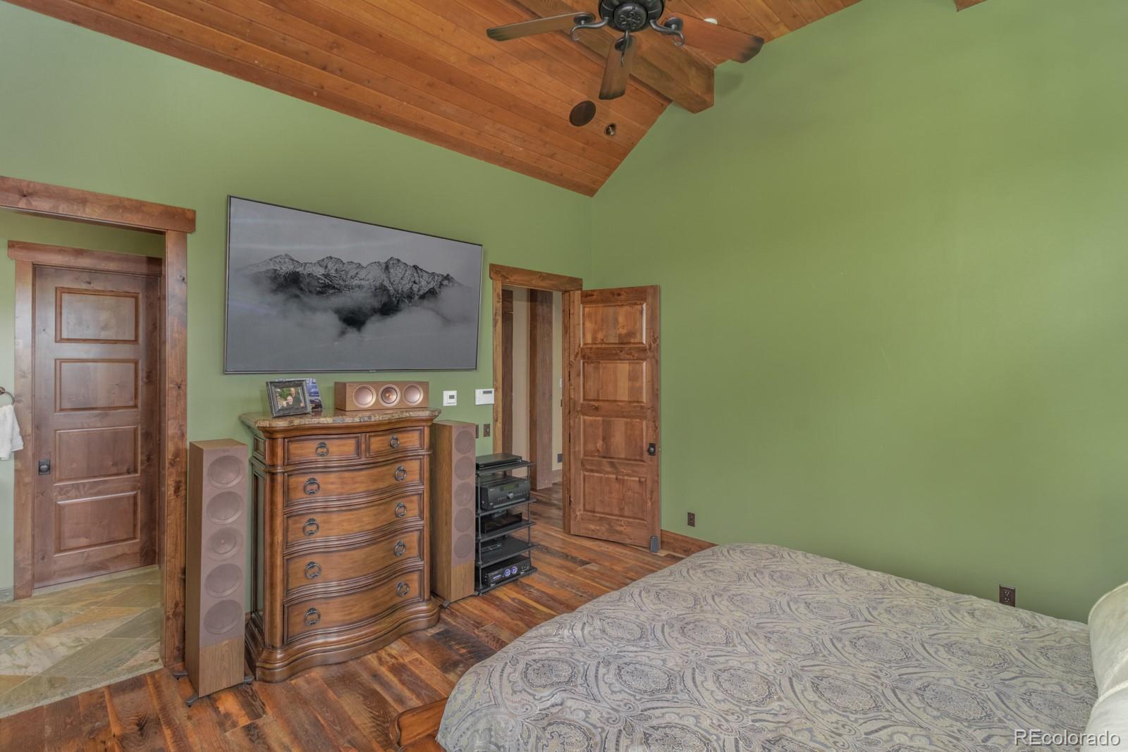 30 West Ranch Trail Morrison, CO 80465 - Photo 19 of 40 a bedroom with a bed and a view of a room