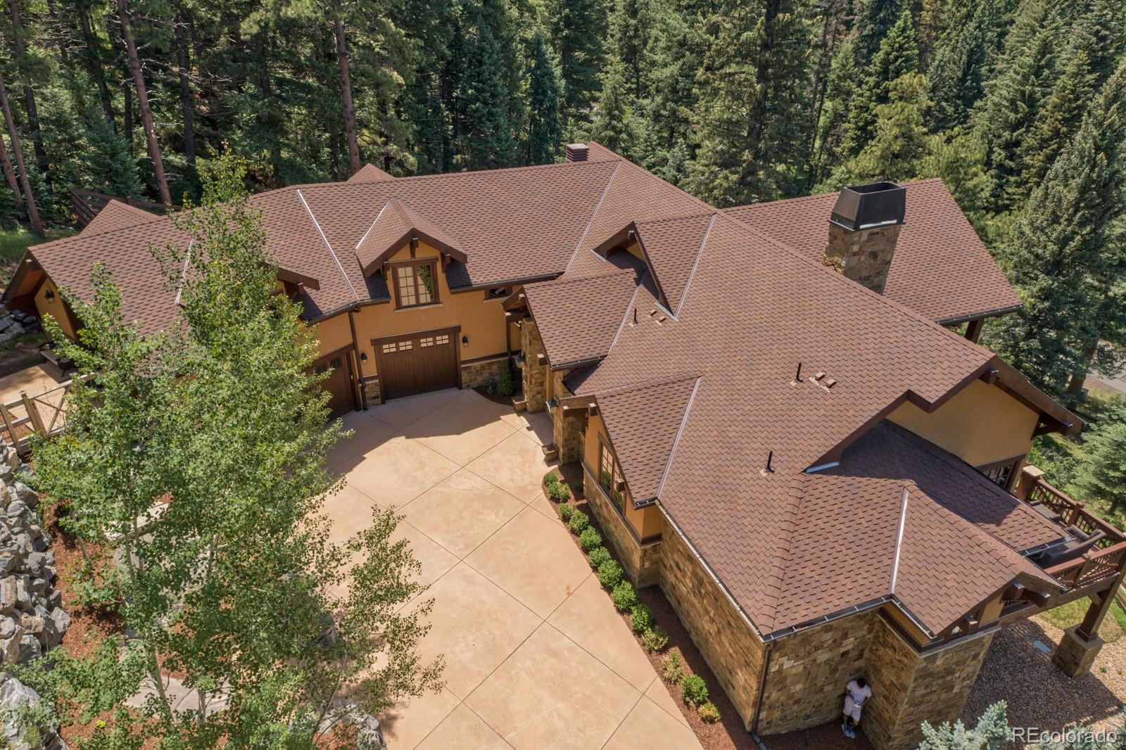 30 West Ranch Trail Morrison, CO 80465 - Photo 2 of 40 an aerial view of a house with a yard