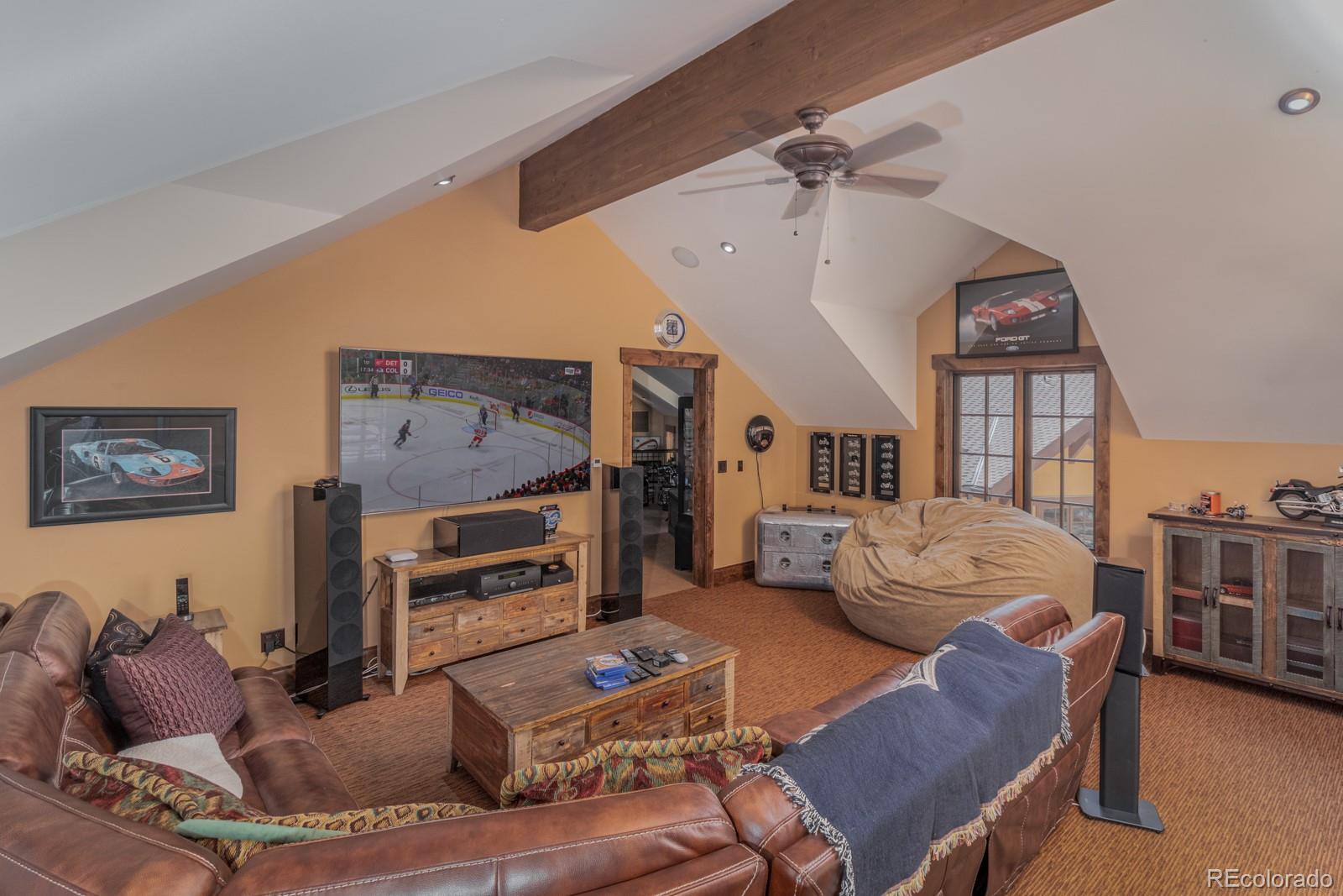 30 West Ranch Trail Morrison, CO 80465 - Photo 28 of 40 a bedroom with furniture and a fireplace