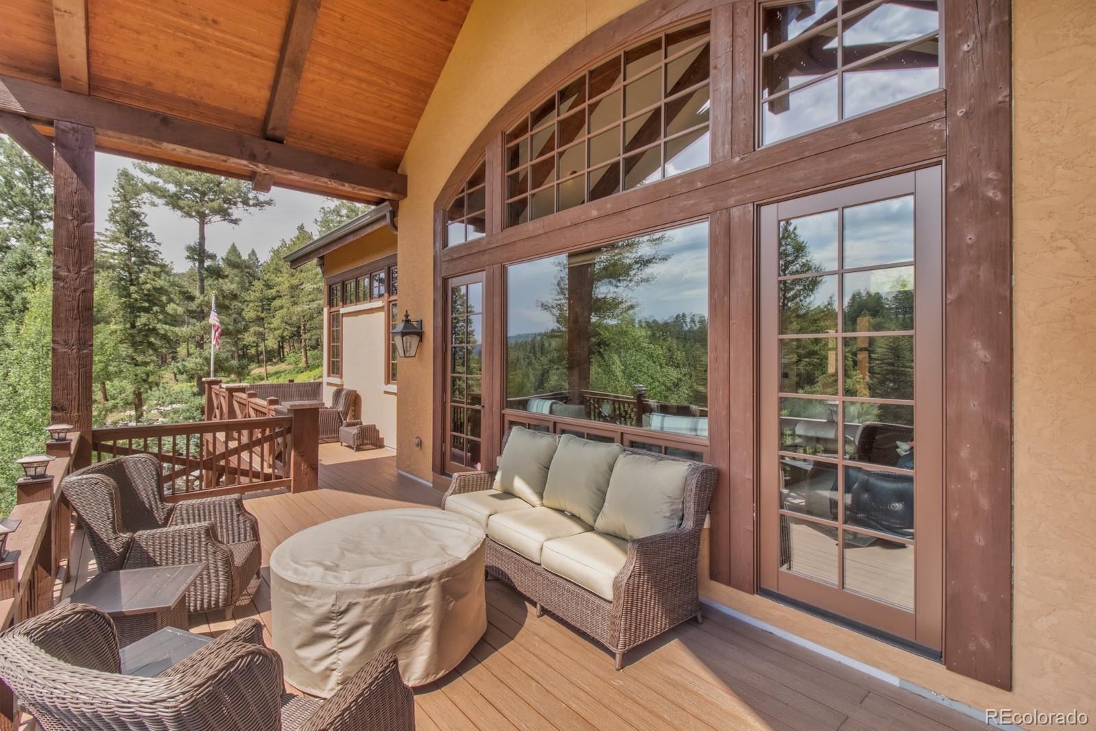 30 West Ranch Trail Morrison, CO 80465 - Photo 31 of 40 a balcony with furniture and outdoor view