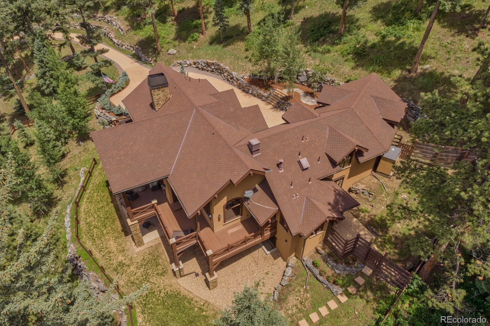 30 West Ranch Trail Morrison, CO 80465 - Photo 40 of 40 an aerial view of a backyard with swimming pool and outdoor seating