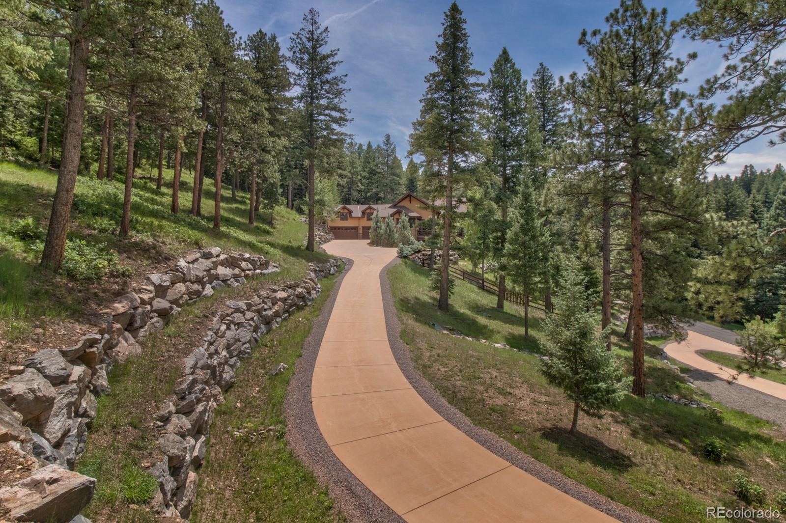 30 West Ranch Trail Morrison, CO 80465 - Photo 5 of 40 a view of a pathway both side of building