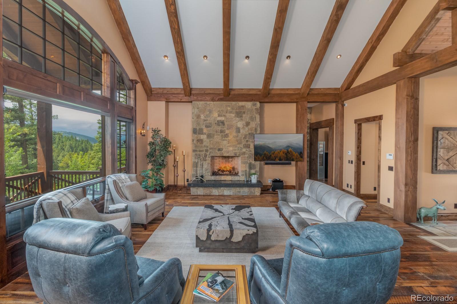 30 West Ranch Trail Morrison, CO 80465 - Photo 9 of 40 a living room with furniture and a large window