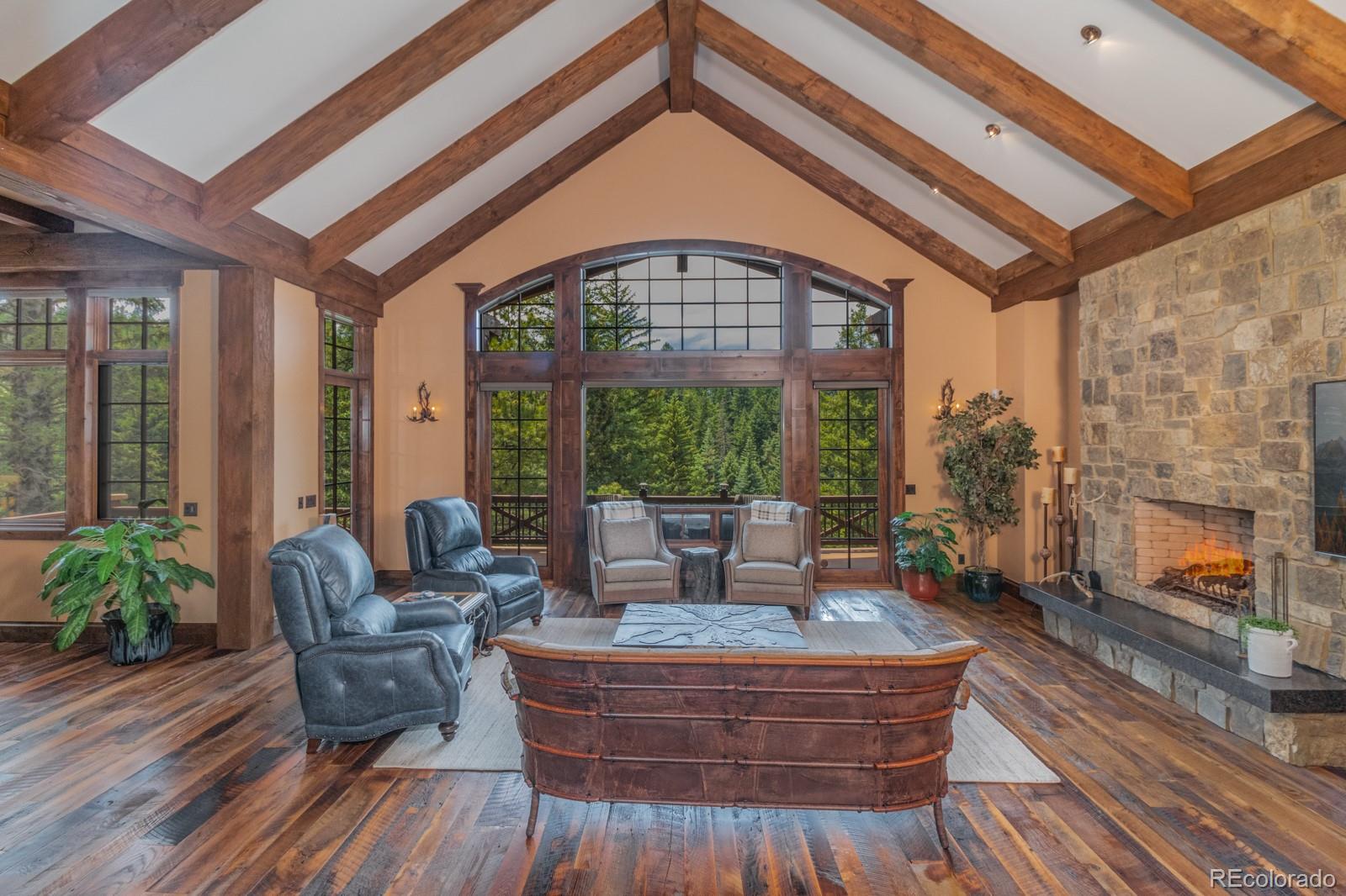 30 West Ranch Trail Morrison, CO 80465 - Photo 10 of 40 a living room with furniture and a fireplace