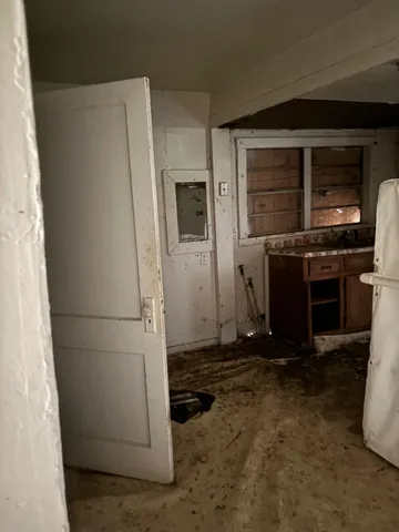 a stove top oven sitting inside of a kitchen