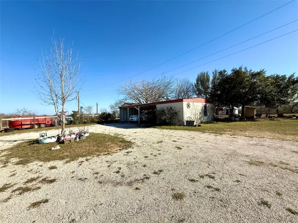 a view of a road with a building in the background
