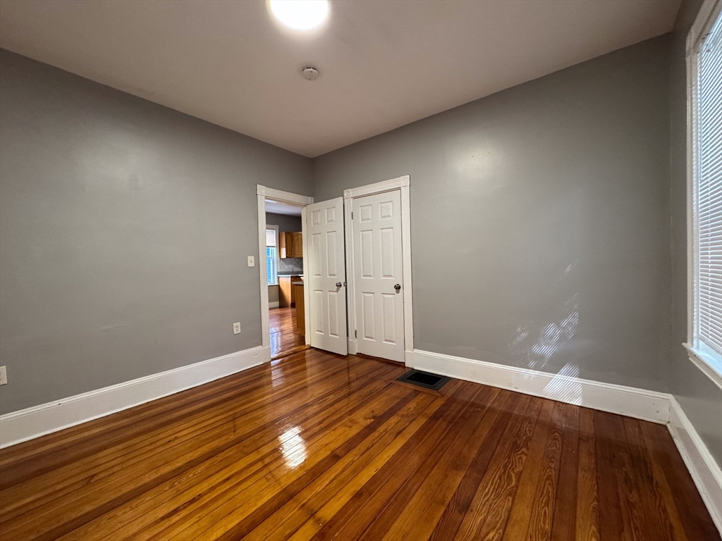 12 Dalrymple Street, Unit 2 Boston, MA 02130 - Photo 11 of 21 a view of an empty room with wooden floor