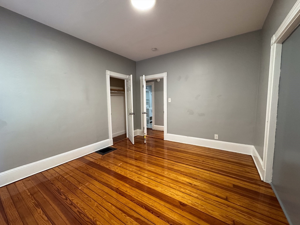 12 Dalrymple Street, Unit 2 Boston, MA 02130 - Photo 18 of 21 a view of an empty room with wooden floor