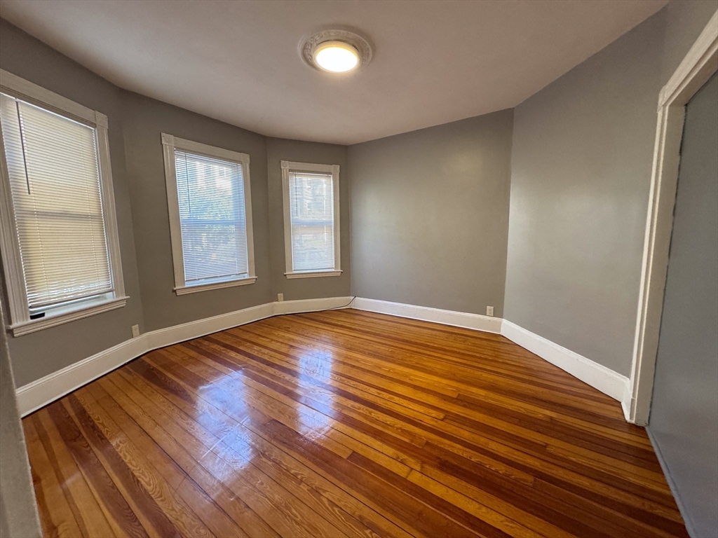 12 Dalrymple Street, Unit 2 Boston, MA 02130 - Photo 21 of 21 a view of empty room with wooden floor and fan