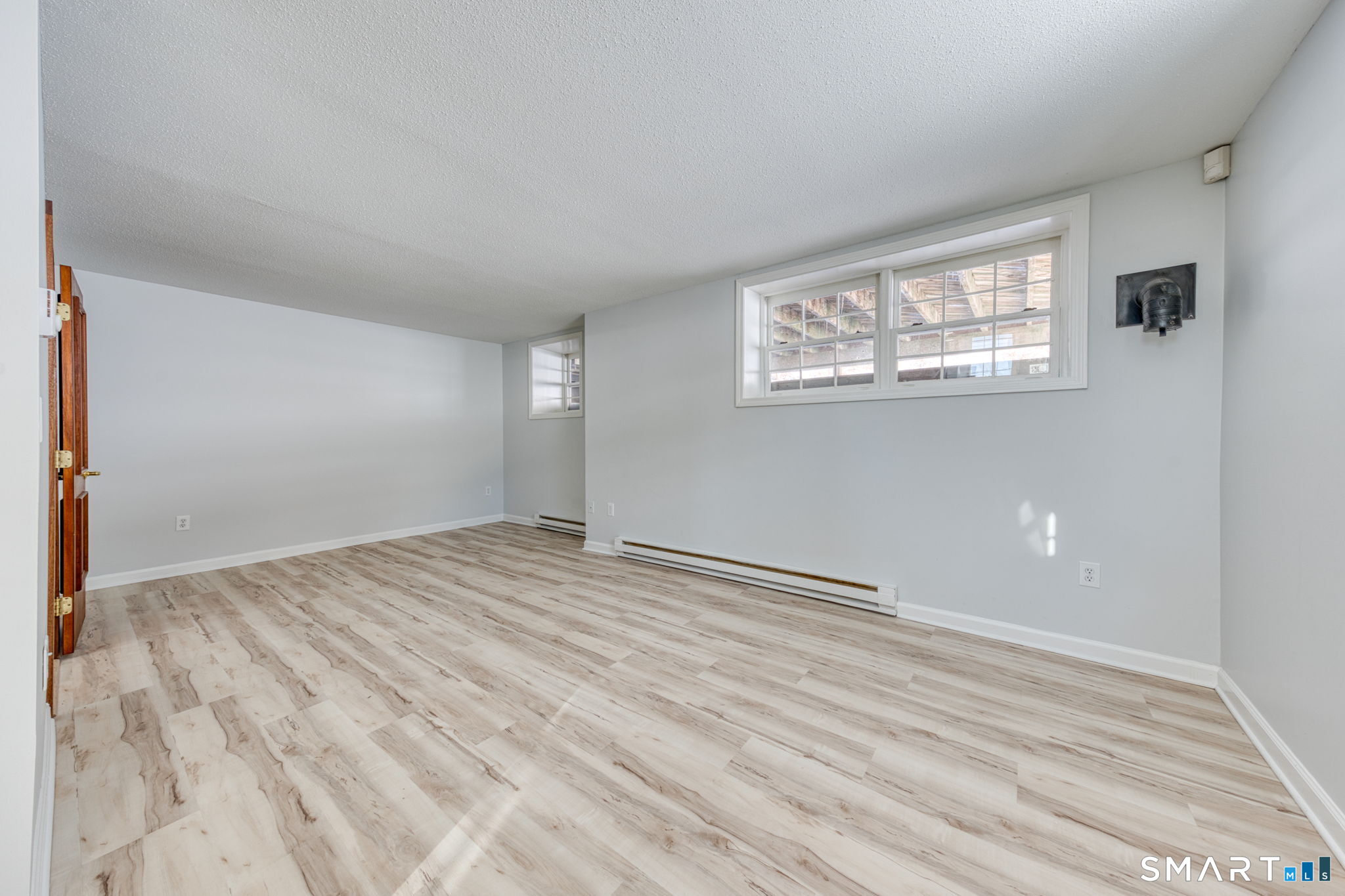 350 Bristol Street, Unit C1 Waterbury, CT 06708 - Photo 4 of 40 a view of empty room with wooden floor