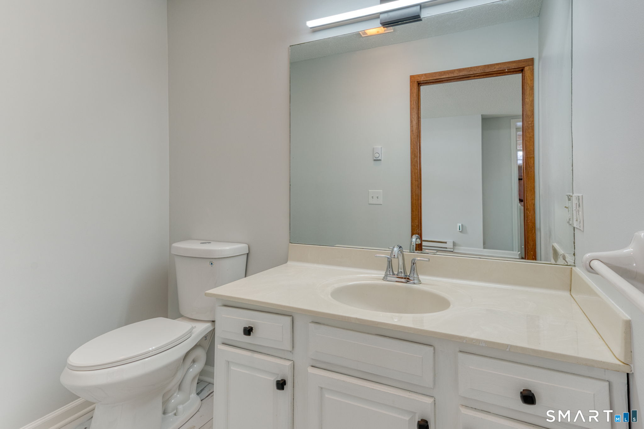 350 Bristol Street, Unit C1 Waterbury, CT 06708 - Photo 7 of 40 a bathroom with a sink toilet and vanity