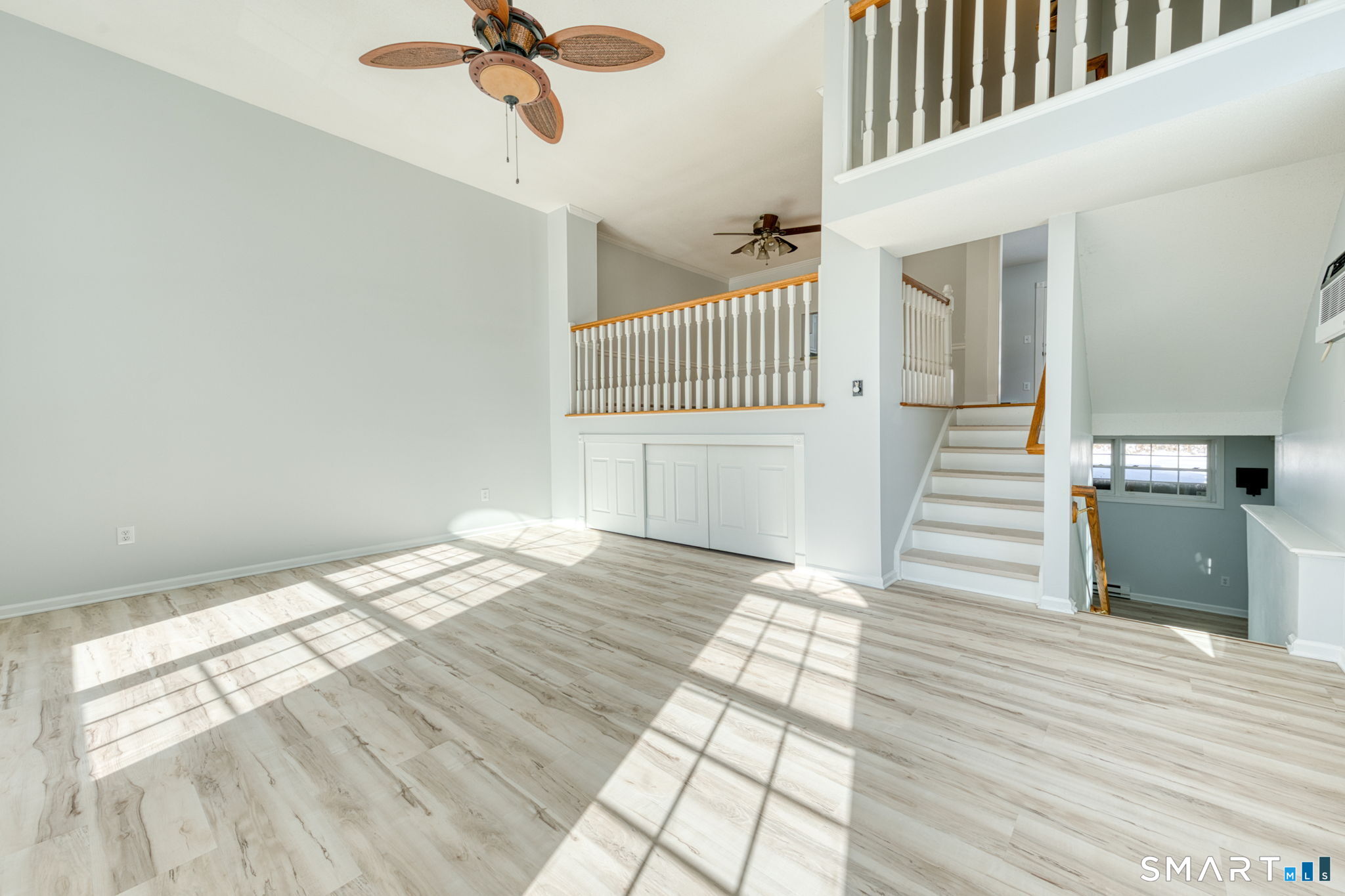 350 Bristol Street, Unit C1 Waterbury, CT 06708 - Photo 8 of 40 a view of a bedroom with wooden floor and staircase
