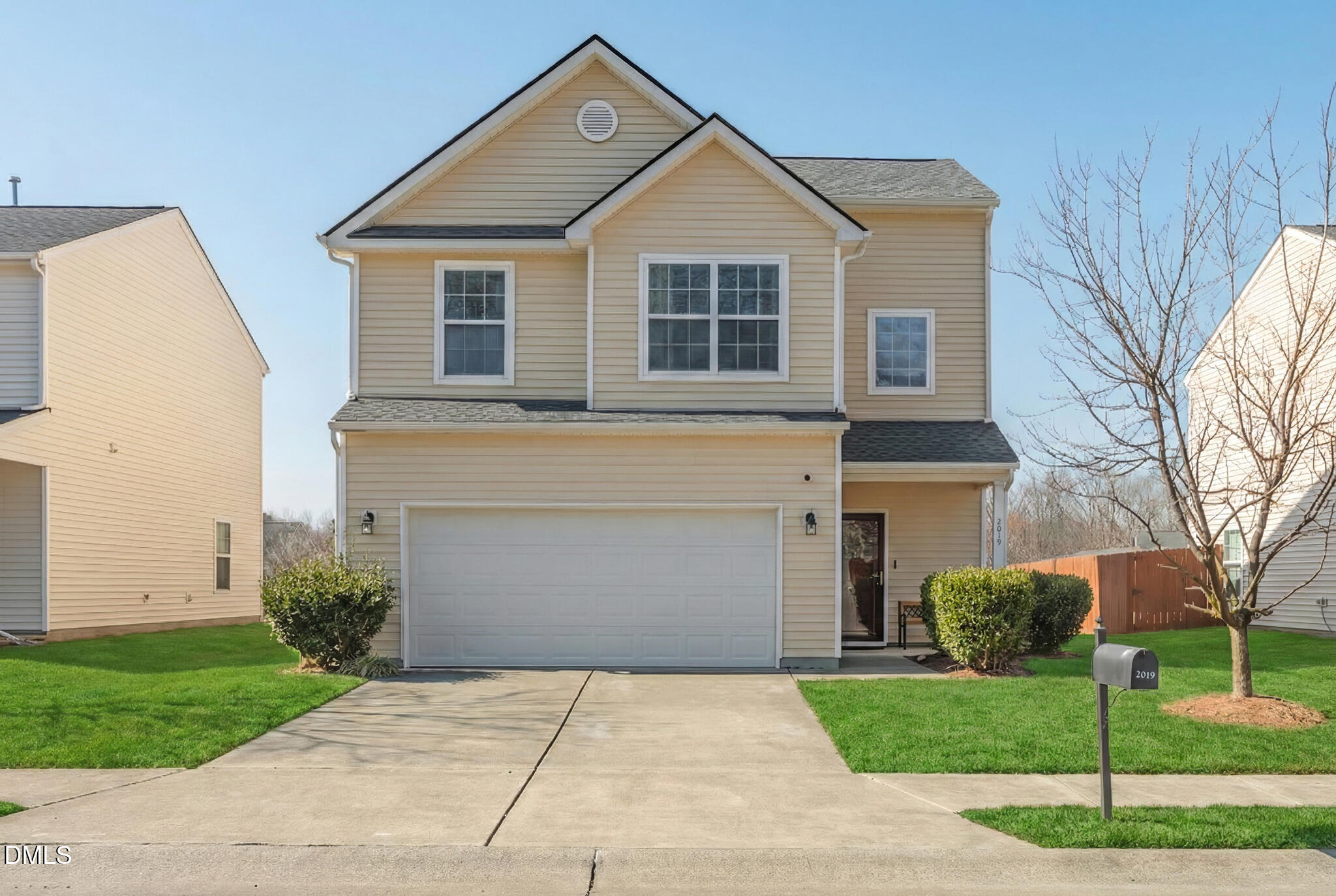 2019 Tennessee Road Durham, NC 27704 - Photo 3 of 28 a front view of a house with a yard and garage