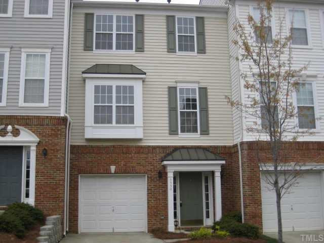 5530 Shady Crest Drive Raleigh, NC 27613 - Photo 1 of 1 a front view of a house with a garage and balcony