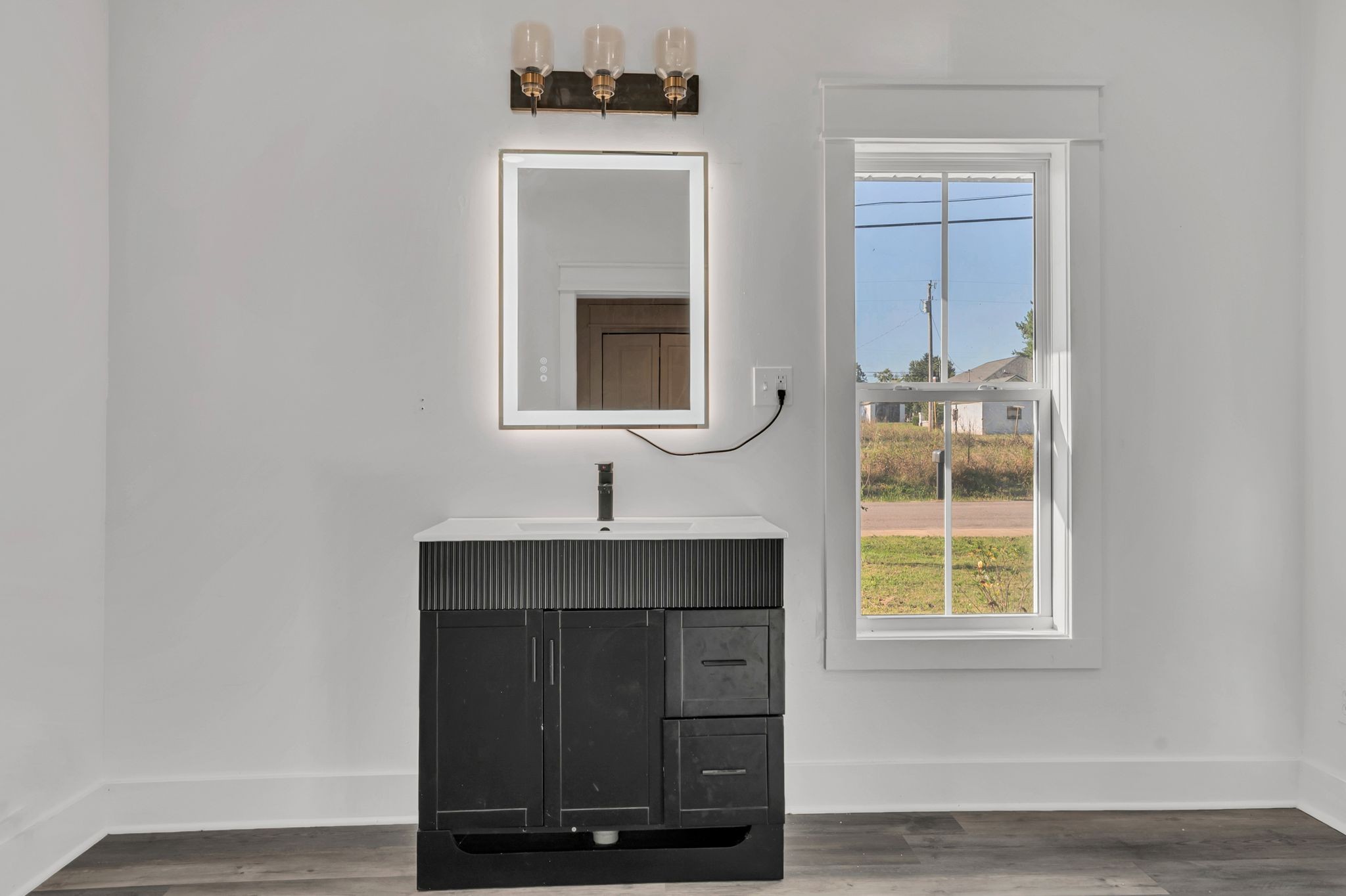 402 England Street East Cowan, TN 37318 - Photo 17 of 23 a bathroom with a sink and a mirror