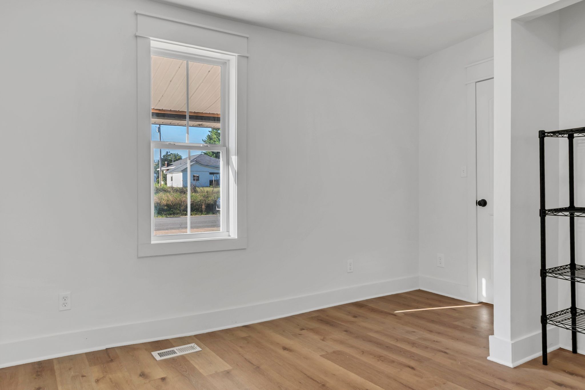 402 England Street East Cowan, TN 37318 - Photo 20 of 23 an empty room with wooden floor and a window