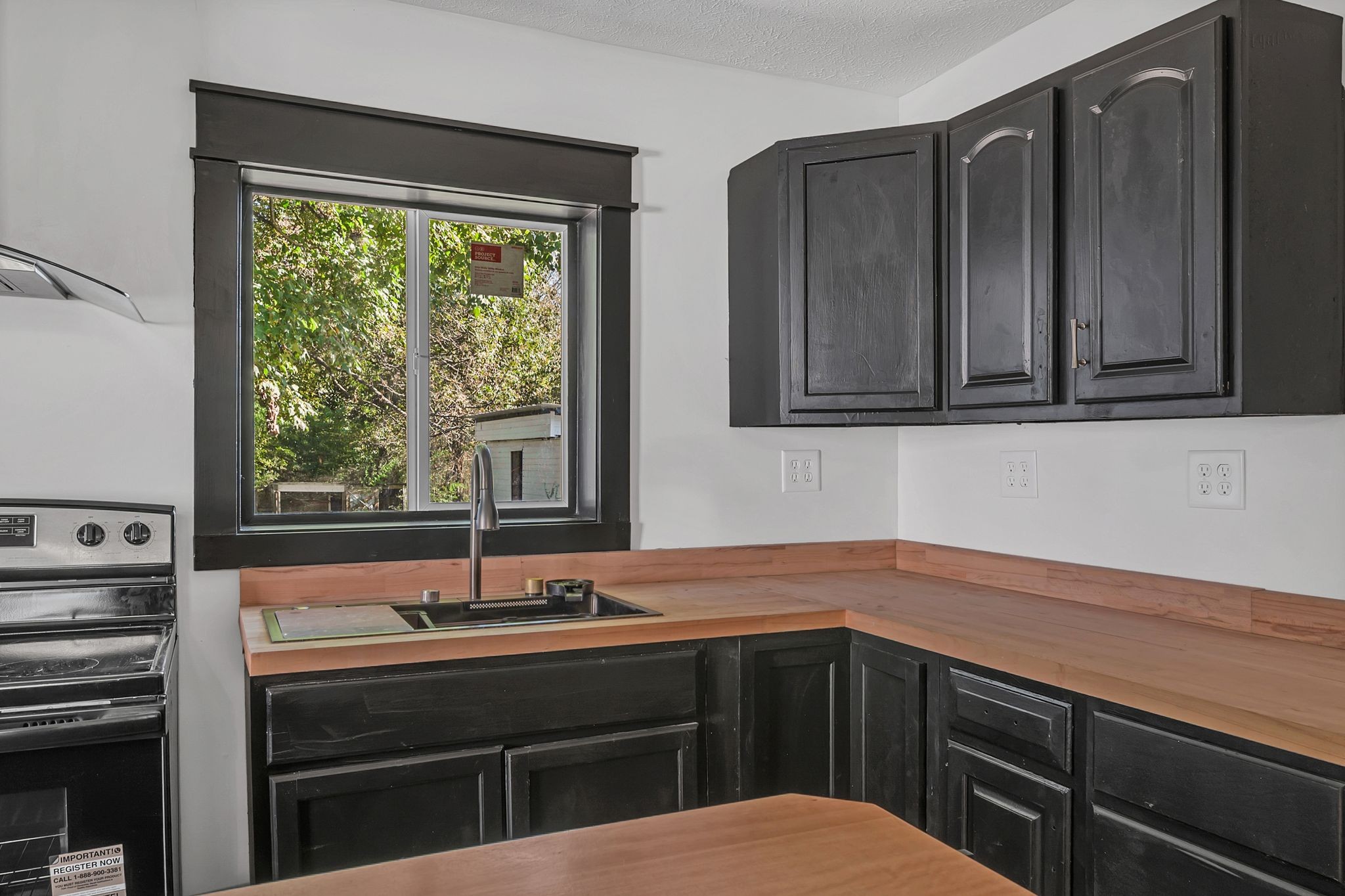 402 England Street East Cowan, TN 37318 - Photo 10 of 23 a kitchen with stainless steel appliances granite countertop a sink and cabinets