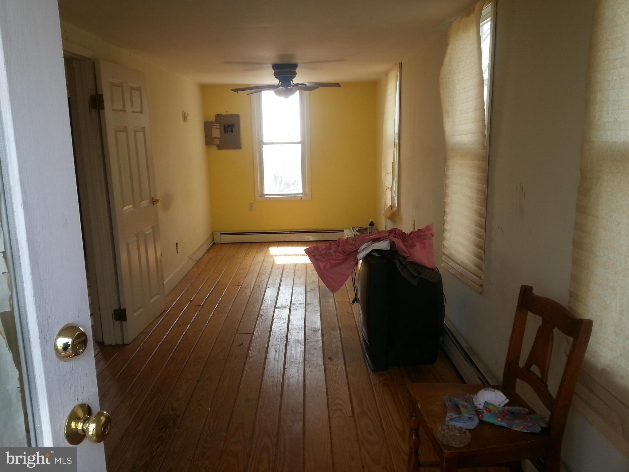 3505 Young Road Manchester, MD 21102 - Photo 2 of 6 a view of a hallway with wooden floor and stairs