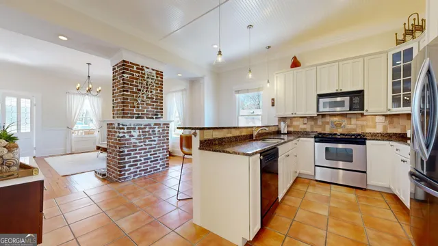 a dining room with furniture and window