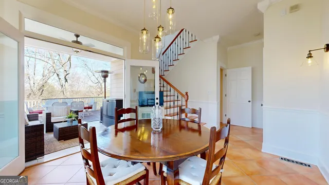 a balcony with wooden floor and furniture