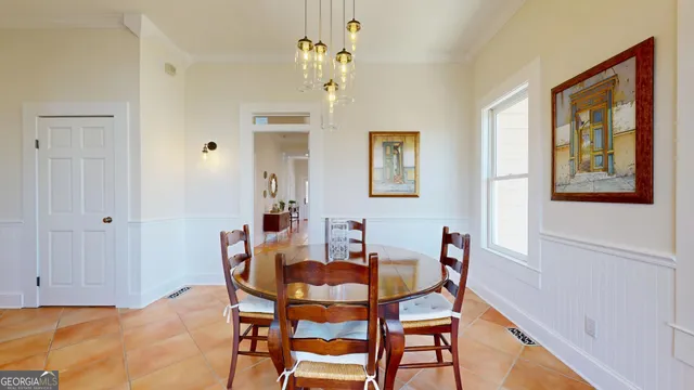 a view of a hallway with furniture and a fireplace
