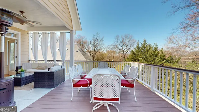 a en suite bathroom with a granite countertop sink and a mirror