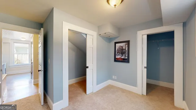 a building outdoor space with patio furniture and potted plants