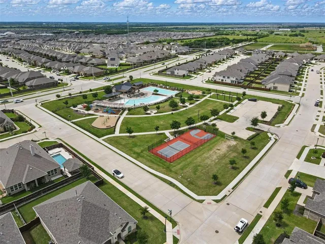 an aerial view of a pool table and chairs