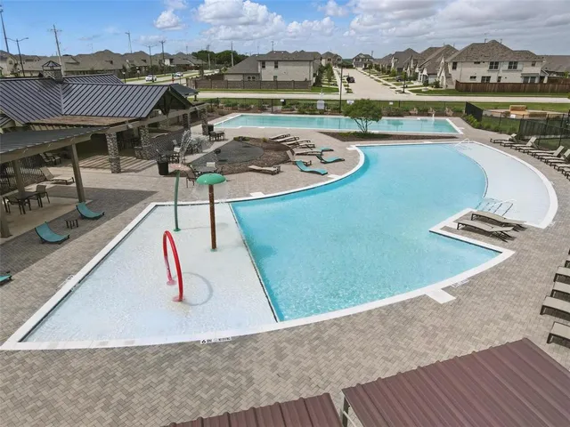 an aerial view of a house with outdoor space
