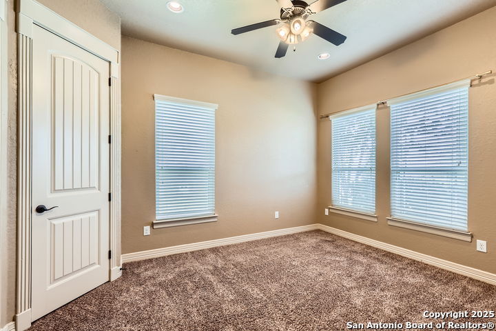 14722 Rifleman Road San Antonio, TX 78254 - Photo 21 of 37 a view of an empty room with a window
