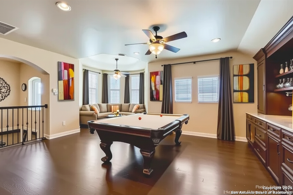 14722 Rifleman Road San Antonio, TX 78254 - Photo 25 of 37 a room with wooden floors table and windows