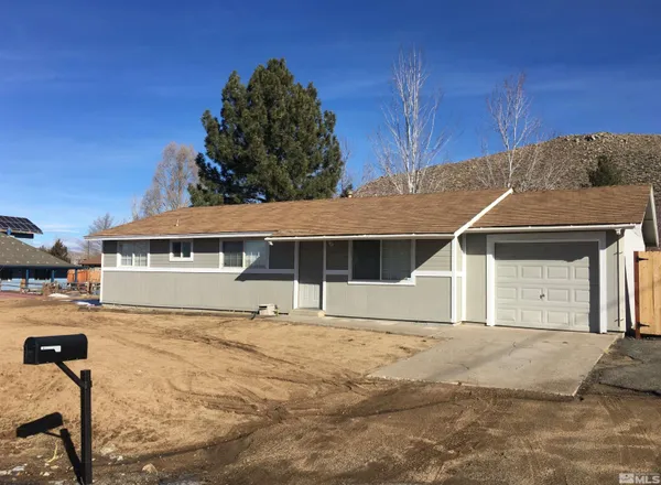 a house with trees in front of it