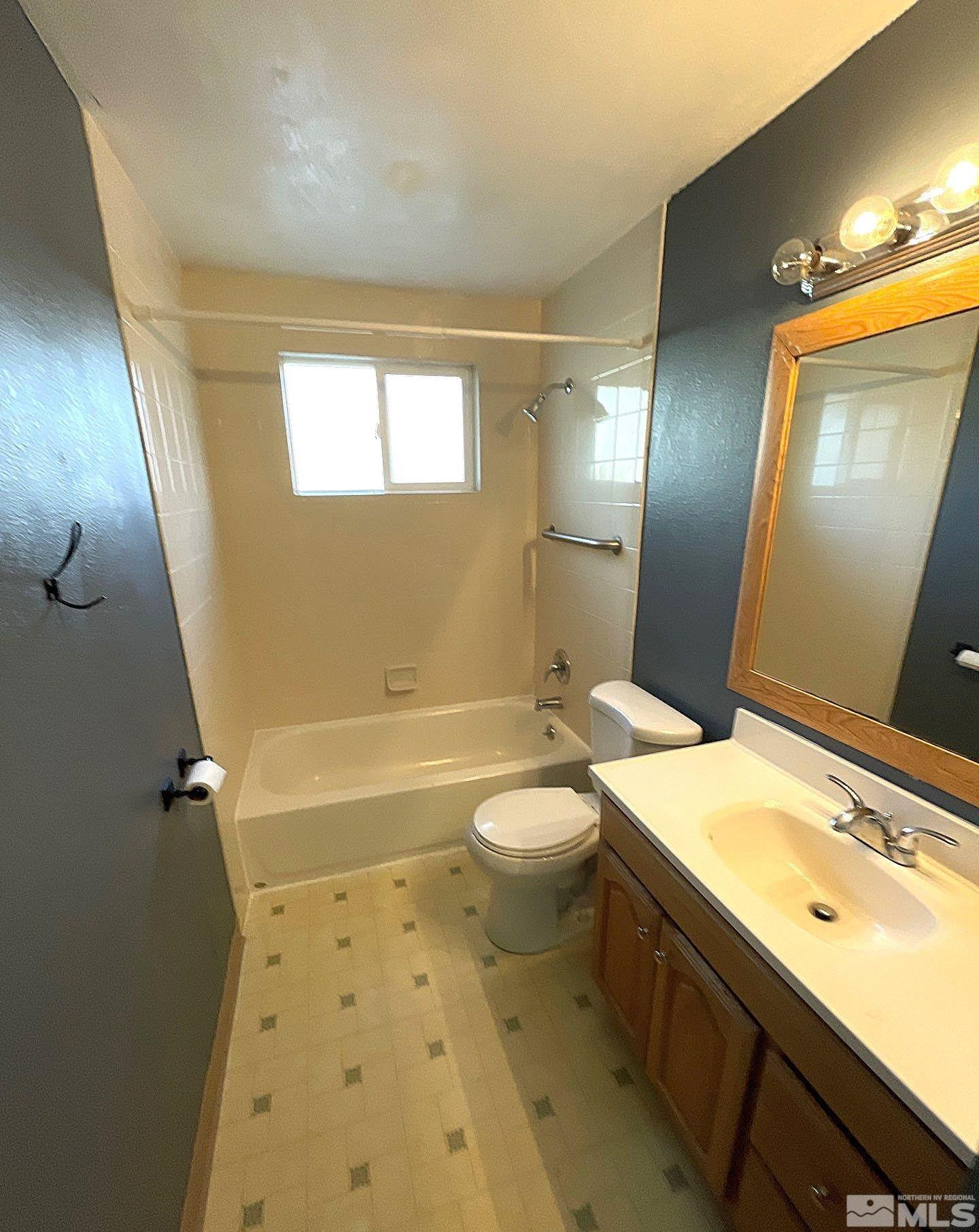 405 Kess Way Reno, NV 89506 - Photo 11 of 14 a bathroom with a sink a toilet and shower