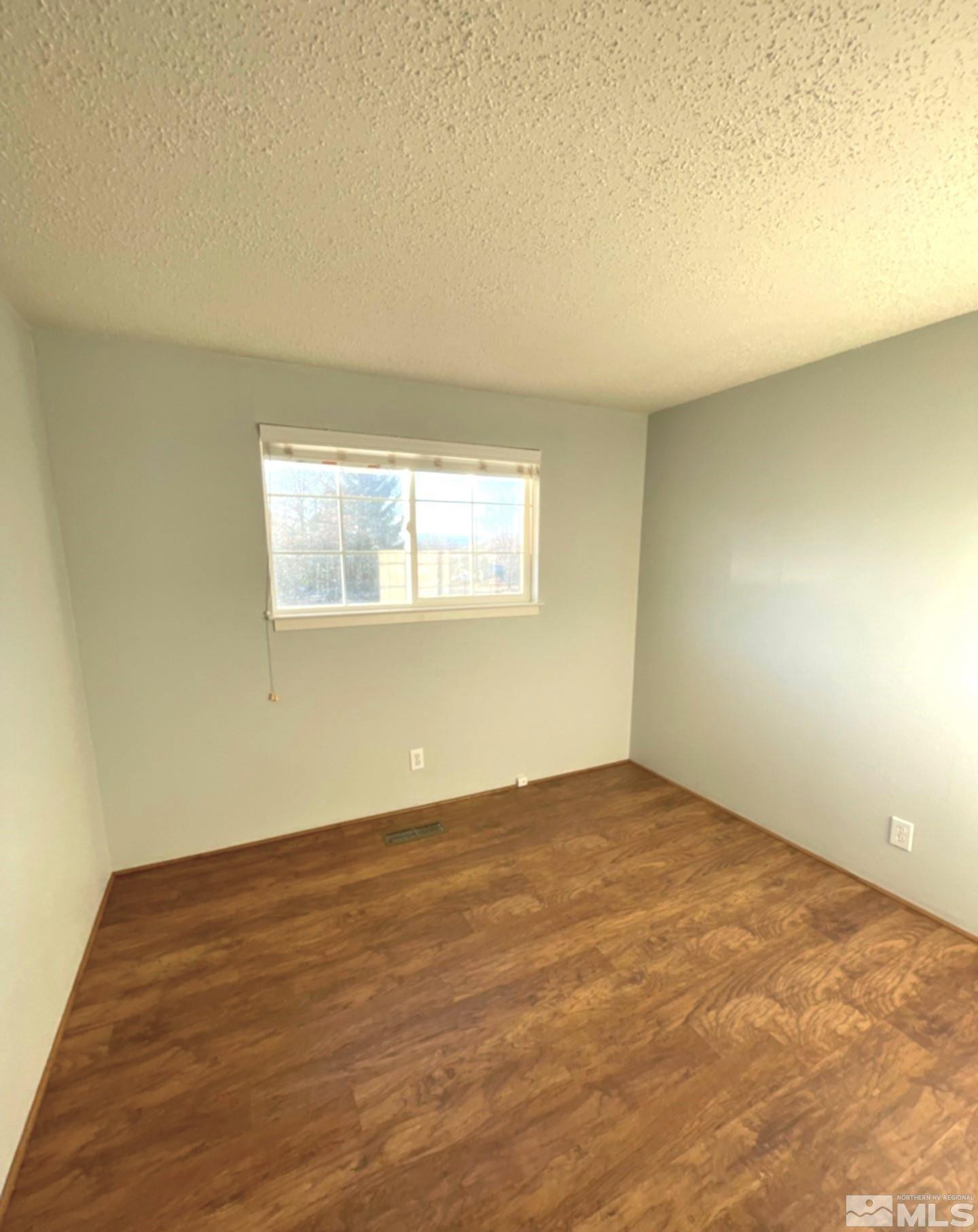 405 Kess Way Reno, NV 89506 - Photo 8 of 14 an empty room with a window