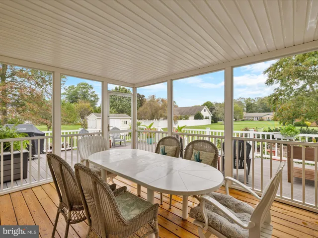 a view of a patio with a table chairs and balcony