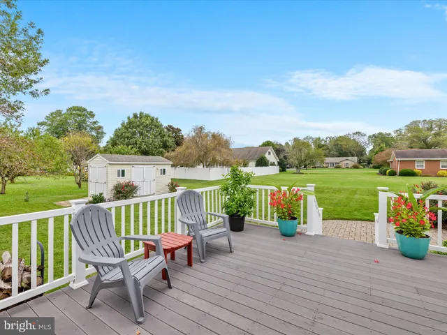 a view of a wooden deck with a bench