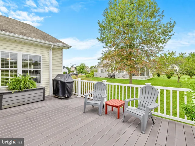 a view of a chair and tables in the garden