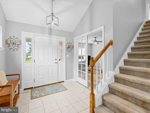 a view of entryway with stairs and furniture