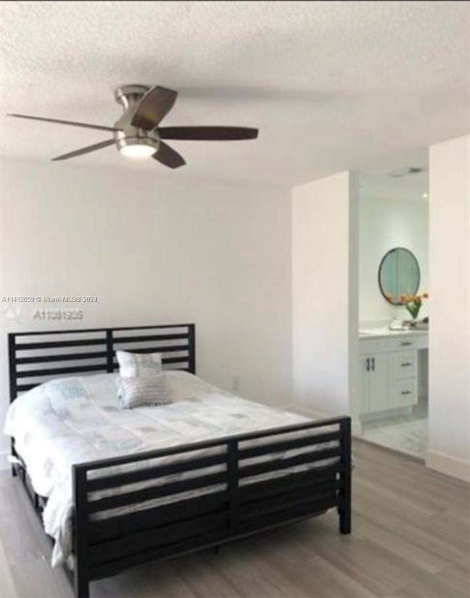 The Hammocks Miami, FL 33196 - Photo 14 of 18 a bedroom with a bed and cabinets