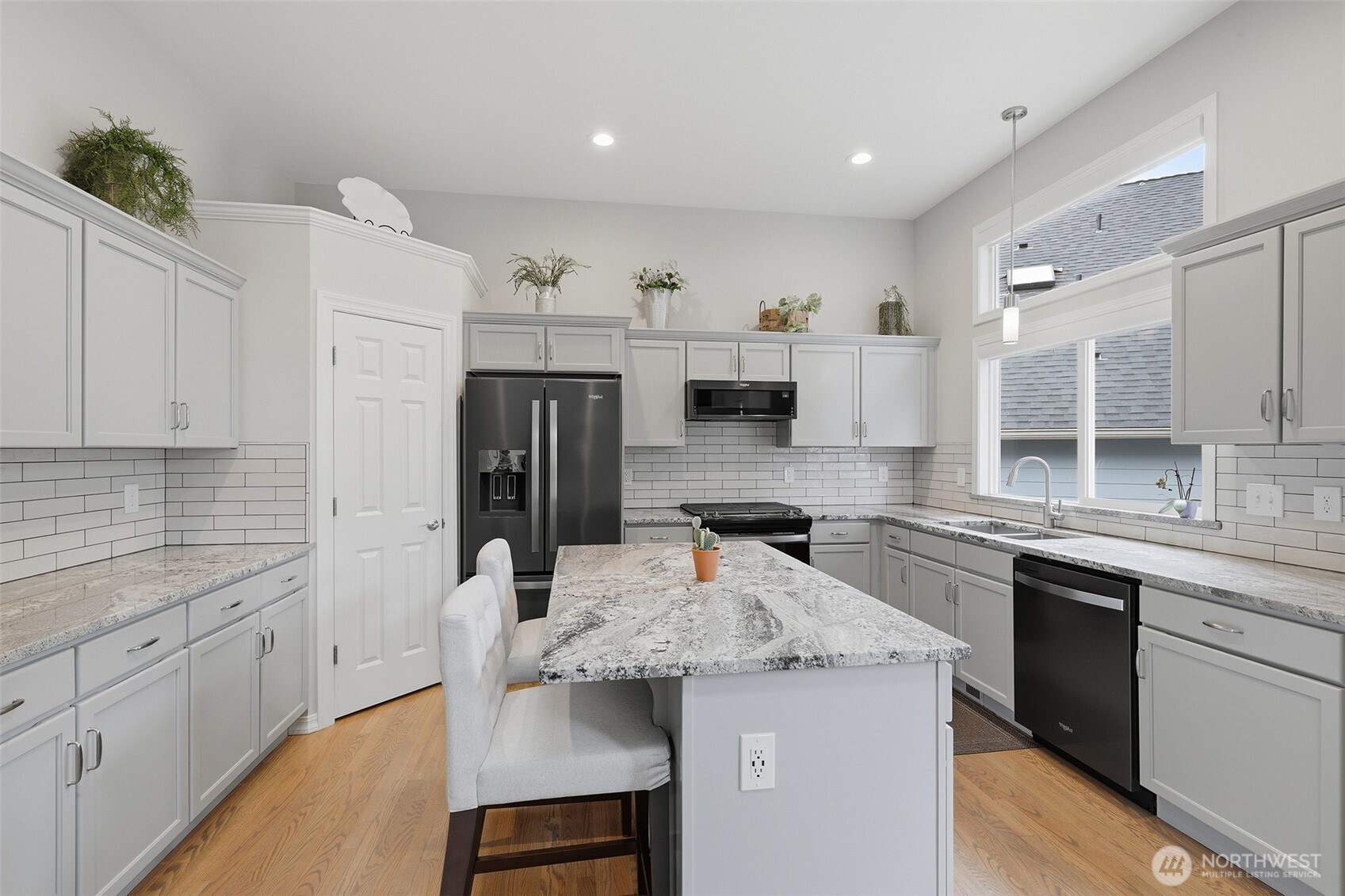 17747 89th Court Northeast Bothell, WA 98011 - Photo 7 of 33 a kitchen with stainless steel appliances granite countertop a sink stove and refrigerator
