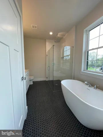a bathroom with a bathtub and a sink