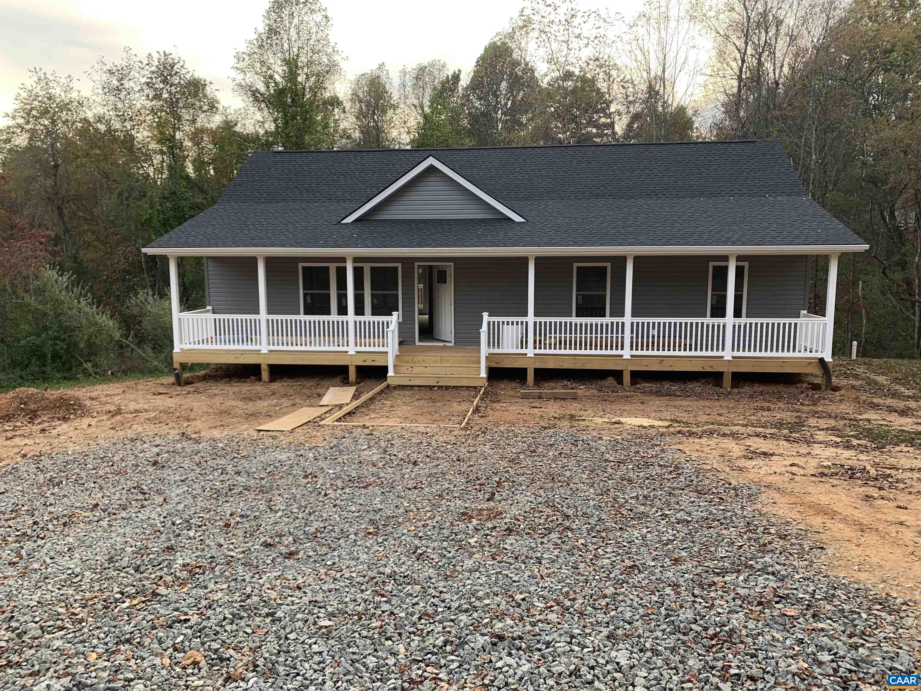 85 Phlox Road Ruckersville, VA 22968 - Photo 3 of 7 a view of a house with a yard and wooden fence