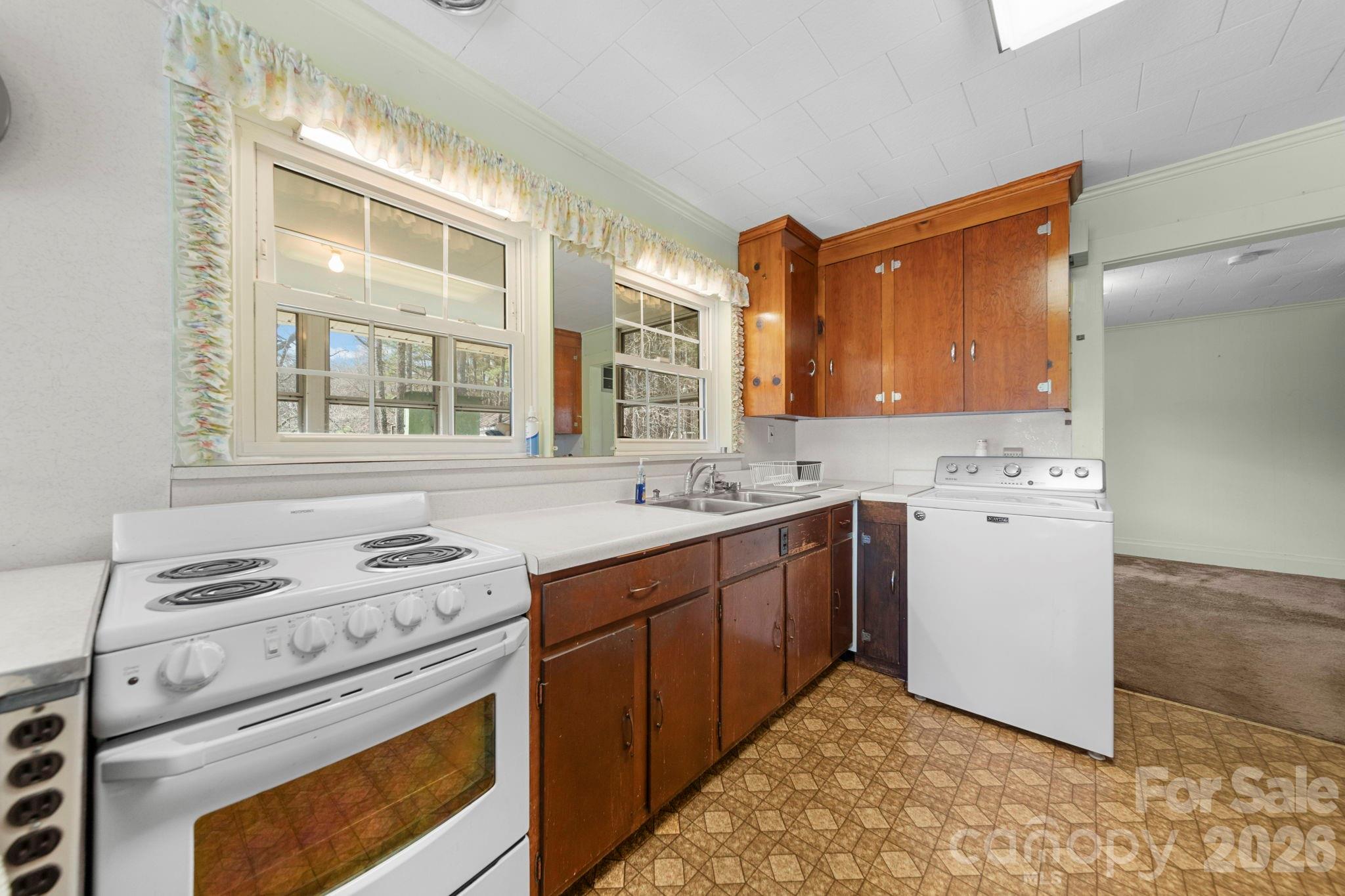 2350 Grubb Ferry Road Salisbury, NC 28144 - Photo 11 of 31 a kitchen with a stove a sink and a refrigerator