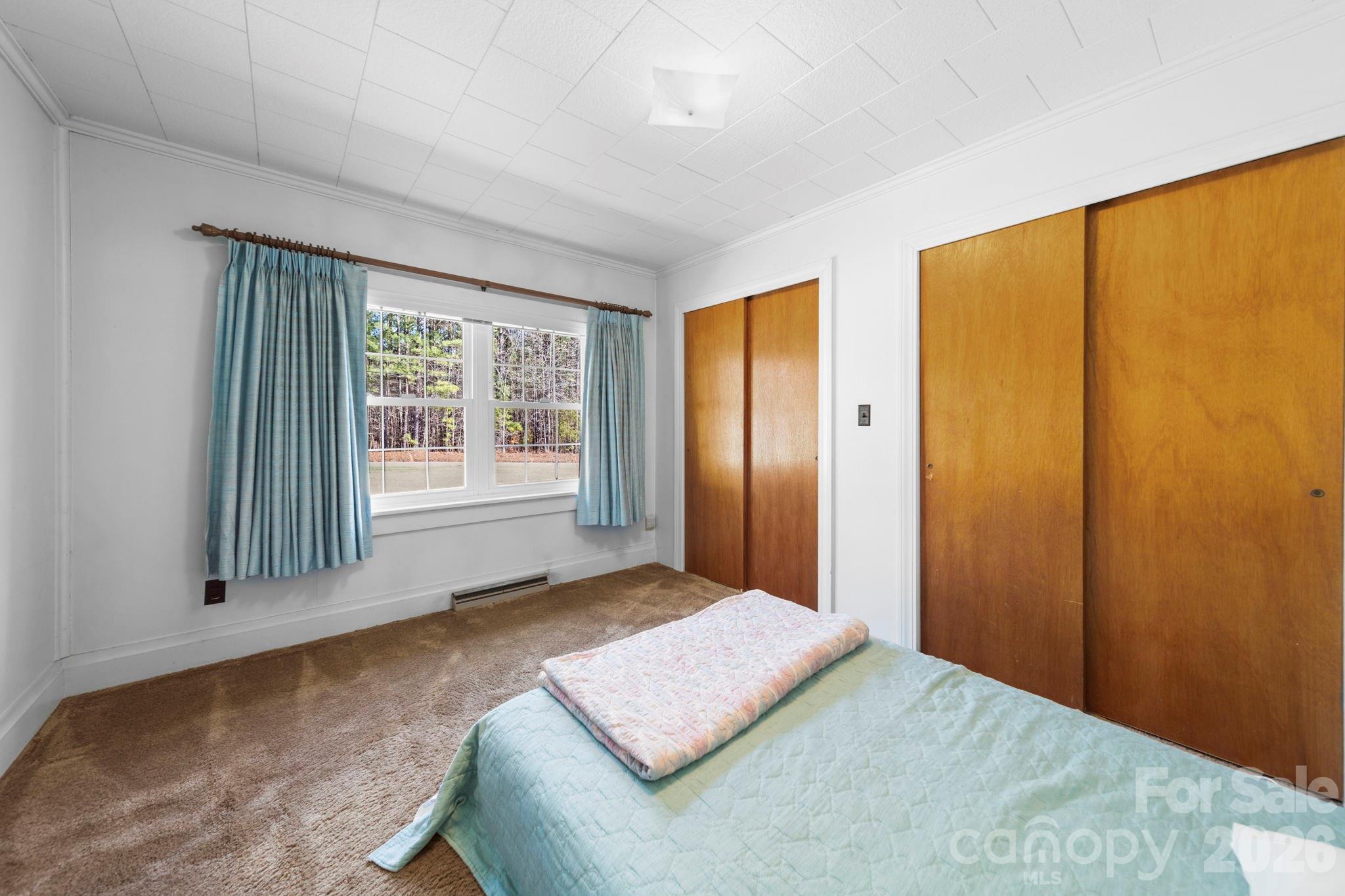 2350 Grubb Ferry Road Salisbury, NC 28144 - Photo 26 of 31 a bedroom with a bed and a window